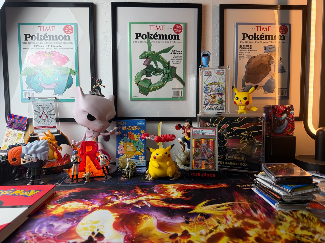 Miguel’s filming table, with Pokémon artwork, figures and trading cards.